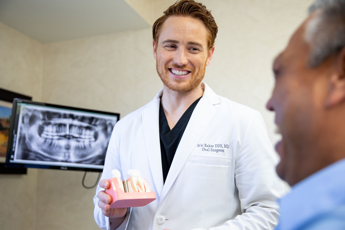 dr baker discussing dental implants procedure Dana Point CA